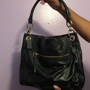 Slightly used black leather Coach hand bag